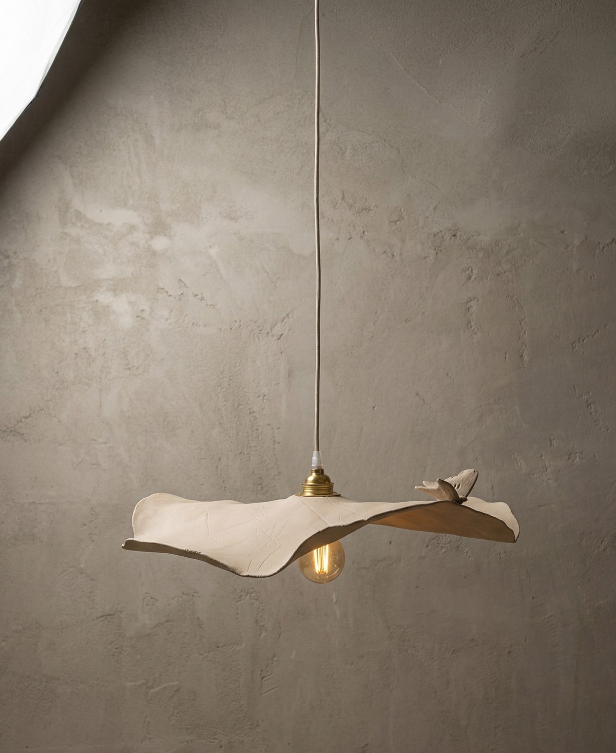 Sculpting Light — handcrafted ceramic lamp with cast organic shadows