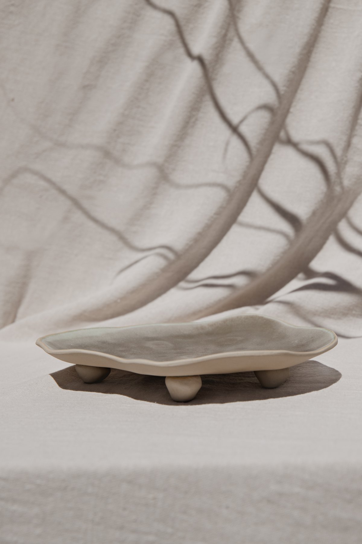 The Pedestal Tray &mdash; a footed tray with an undulating organic rim