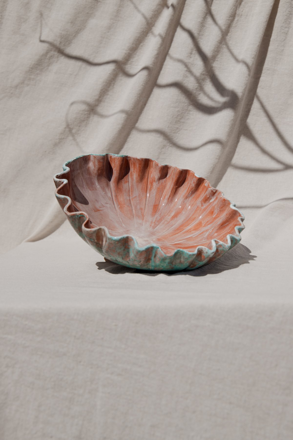 The Pleated Vessel &mdash; a shallow vessel with a pleated wavy rim in turquoise and terracotta