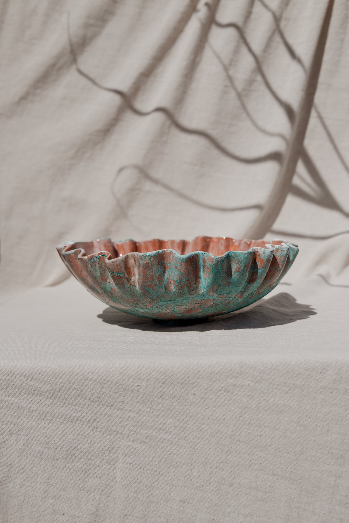 The Pleated Vessel &mdash; alternate angle showing the textured turquoise exterior