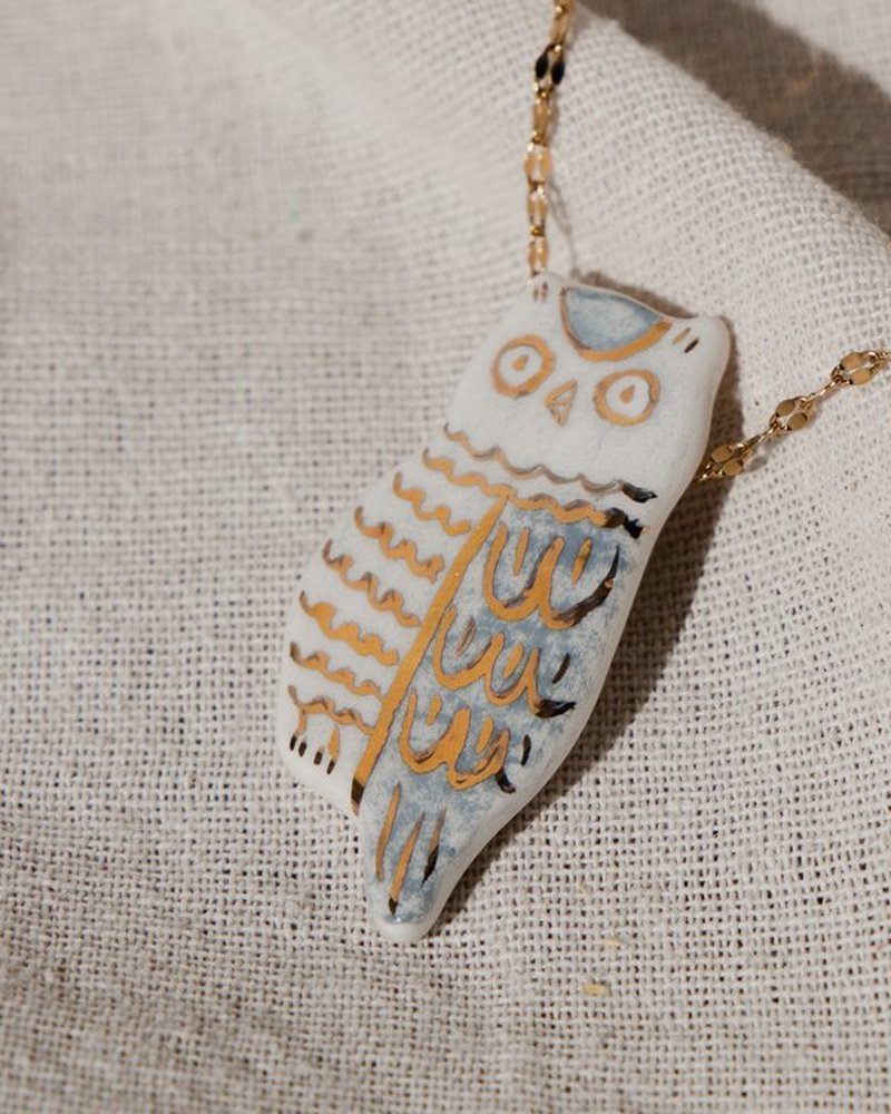 The Owl Pendant &mdash; close-up of the hand-painted gold detailing