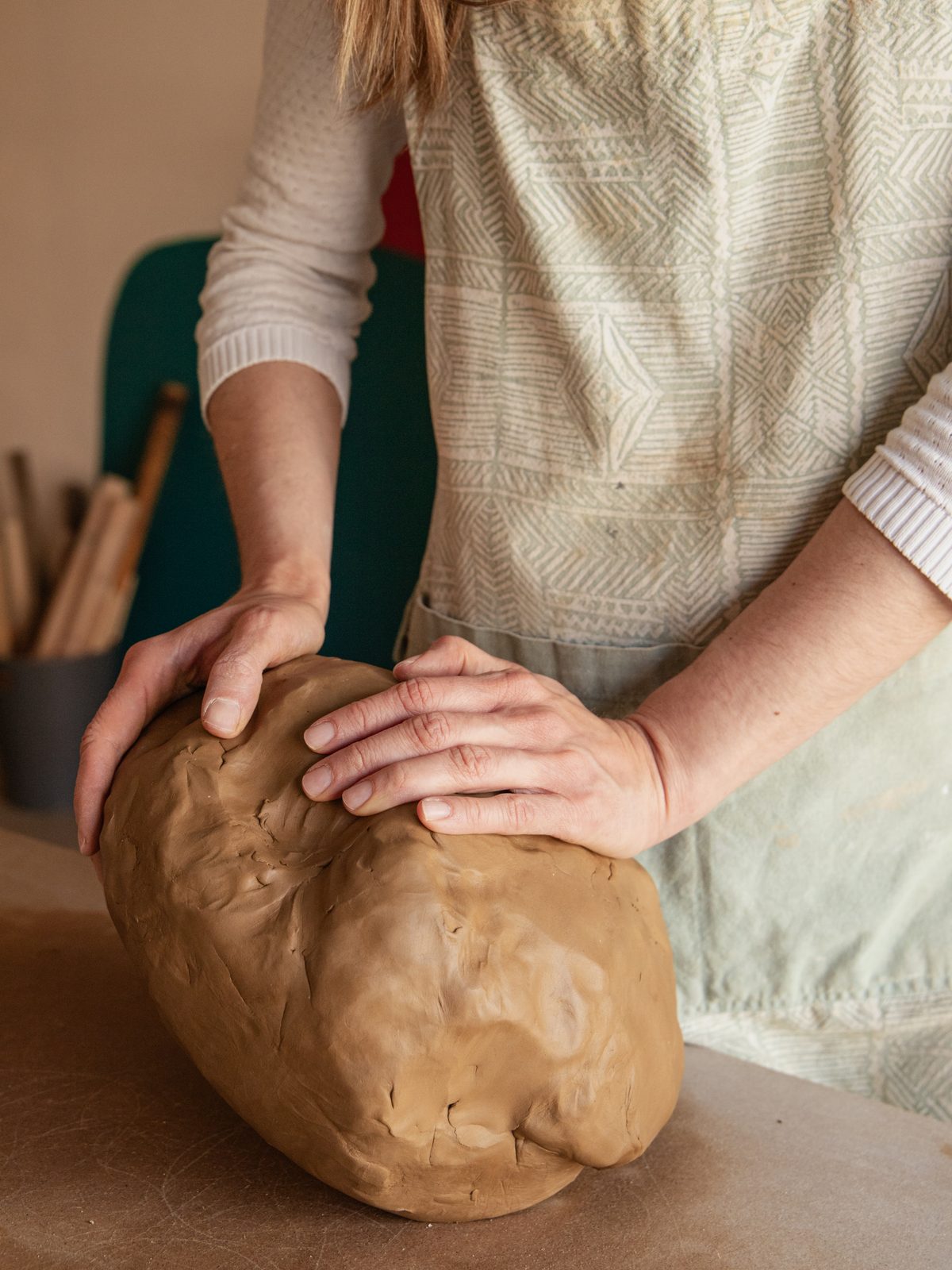 Wedging and preparing raw clay by hand