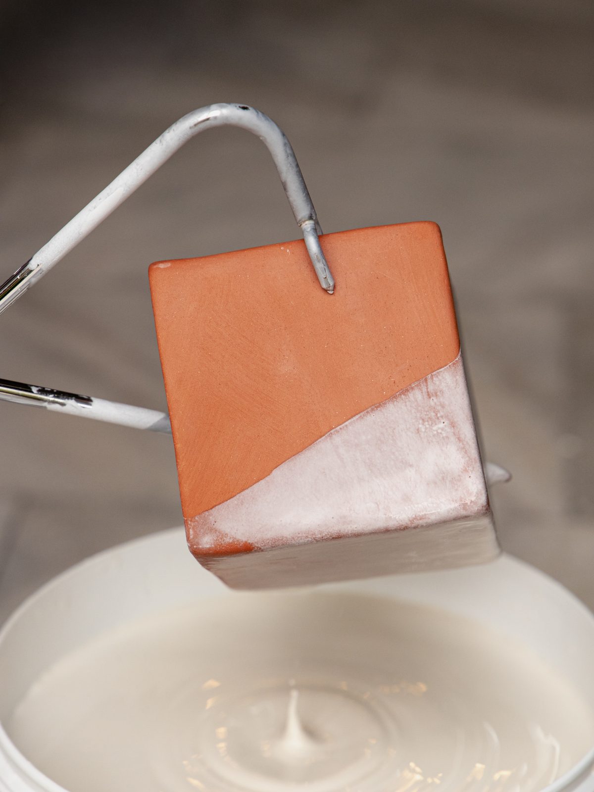 Hand-applying glazes to a ceramic piece